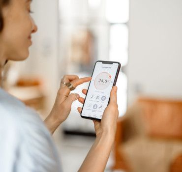 MyAir 5 touchscreen smart air conditioning panel in a modern Brisbane home
